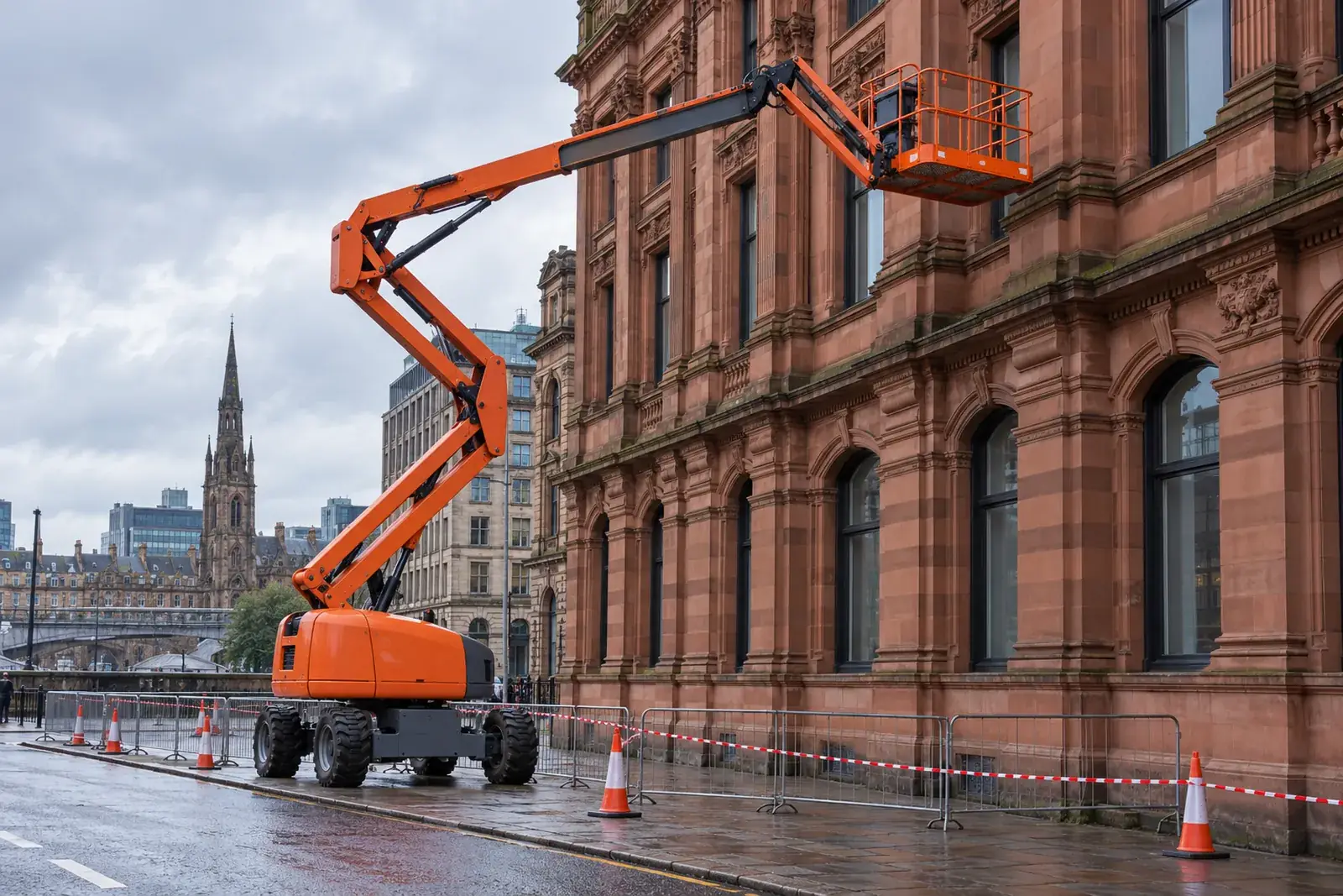 Cherry picker positioned beside a sandstone commercial elevation